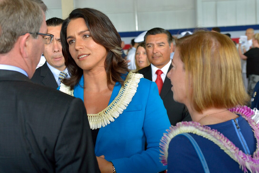 U.S. Rep. Tulsi Gabbard of Hawaii's second district visits with Defense Secretary Ash Carter after change-of-command ceremonies for U.S. Pacific Command and U.S. Pacific Fleet in Honolulu May 27, 2015.