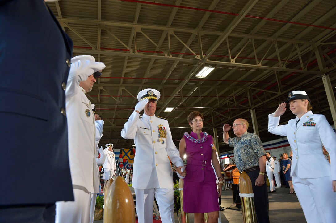 Former U.S. Pacific Command Commander Navy Adm. Samuel J. Locklear, III, and his wife Pamela pass through sideboys at the conclusion of change-of-command ceremonies for U.S. Pacific Command and U.S. Pacific Fleet in Honolulu May 27, 2015.