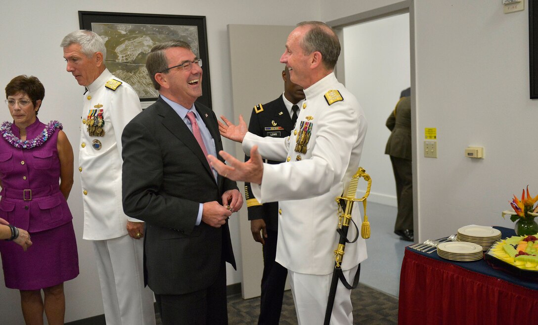 Defense Secretary Ash Carter visits with Navy Adm. Jonathan W. Greenert, chief of Naval Operations, during a reception before the change-of-command ceremonies for U.S. Pacific Command and U.S. Pacific Fleet in Honolulu May 27, 2015. 