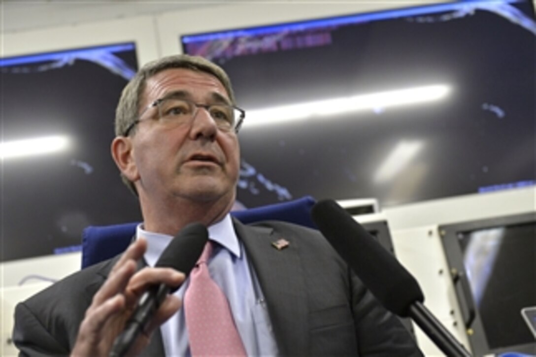 Defense Secretary Ash Carter conducts an in-flight briefing en route to Singapore, May 27, 2015. Carter is on a 10-day trip to advance the next phase of the Asia-Pacific rebalance.  