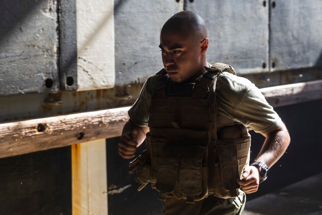 U.S. Marine Lance Cpl. Daniel Del Rio runs to honor fallen service members during physical training aboard the USS Rushmore (LSD 47) at sea in the Pacific Ocean, May 25, 2015. Del Rio is a rifleman with Kilo Compnay, Battalion Landing Team 3rd Battalion, 1st Marine Regiment, 15th Marine Expeditionary Unit. In honor of Memorial Day, Marines with BLT 3/1 ran the ‘Memorial Day Murph’ challenge. The physical fitness event is named after Medal of Honor recipient U.S. Navy Lt. Michael P. Murphy. The challenge developed from Murphy’s daily work out routine, which consisted of a one-mile run, 100 pull-ups, 200 push-ups, 300 squats, and finishing with another one-mile run. (U.S. Marine Corps photo by Sgt. Emmanuel Ramos/Released)