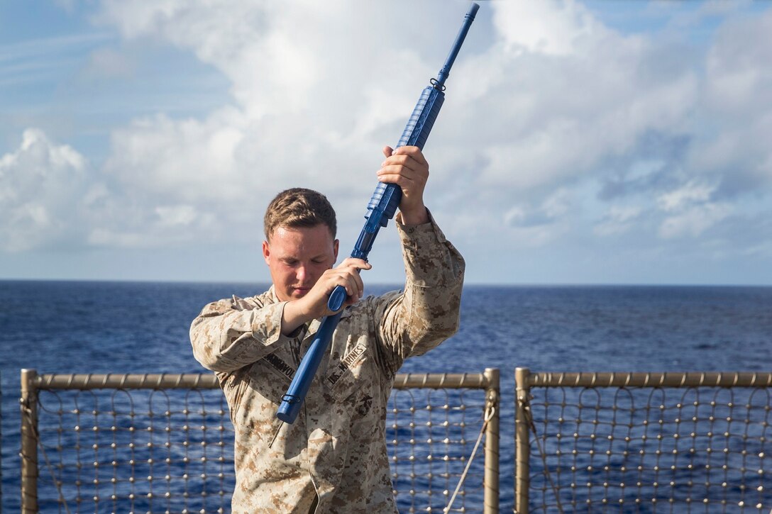 U.S. Marine Lance Cpl. Martynas Dabravolskis practice striking techniques during Marine Corps Martial Arts Program training aboard the USS Rushmore (LSD 47) at sea in the Pacific Ocean, May 26, 2015. Dabravolskis is a landing support specialist with Combat Logistics Battalion 15, 15th Marine Expeditionary Unit. MCMAP focuses on hand-to-hand combat training essential to mission readiness while deployed with the 15th MEU. (U.S. Marine Corps photo by Sgt. Emmanuel Ramos/Released)