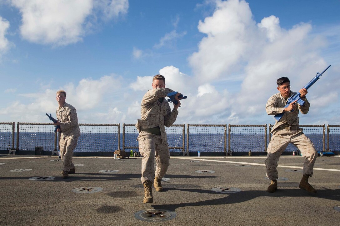 U.S. Marines with Combat Logistics Battalion 15, 15th Marine Expeditionary Unit, practice striking techniques during Marine Corps Martial Arts Program training aboard the USS Rushmore (LSD 47) at sea in the Pacific Ocean, May 26, 2015. MCMAP focuses on hand-to-hand combat training essential to mission readiness while deployed with the 15th MEU. (U.S. Marine Corps photo by Sgt. Emmanuel Ramos/Released)