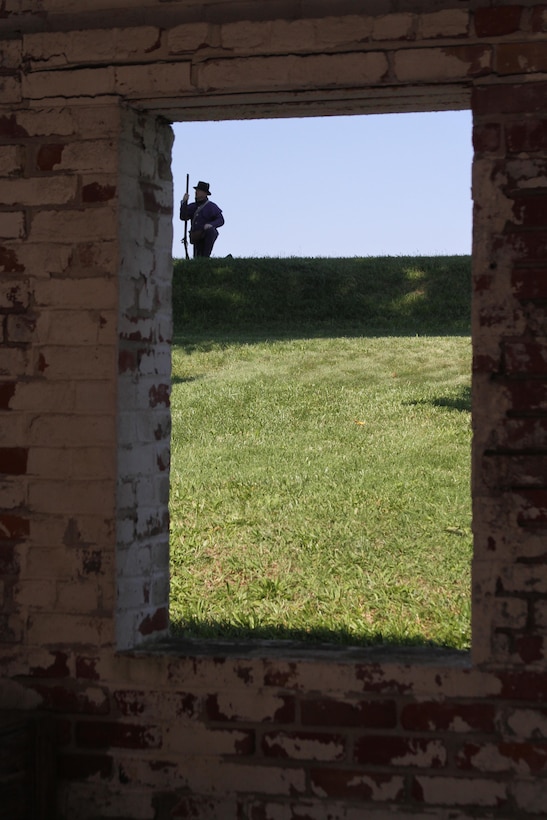 FORT NORFOLK, Va. -- A War of 1812 reenactor is visible through the fort's stable window June 9, 2012. The reenactors were part of OpSail 2012, which marked the bicentennial of the War of 1812 and brought international tall ships and naval vessels to Hampton Roads and other port cities.  (U.S. Army photo/Kerry Solan)