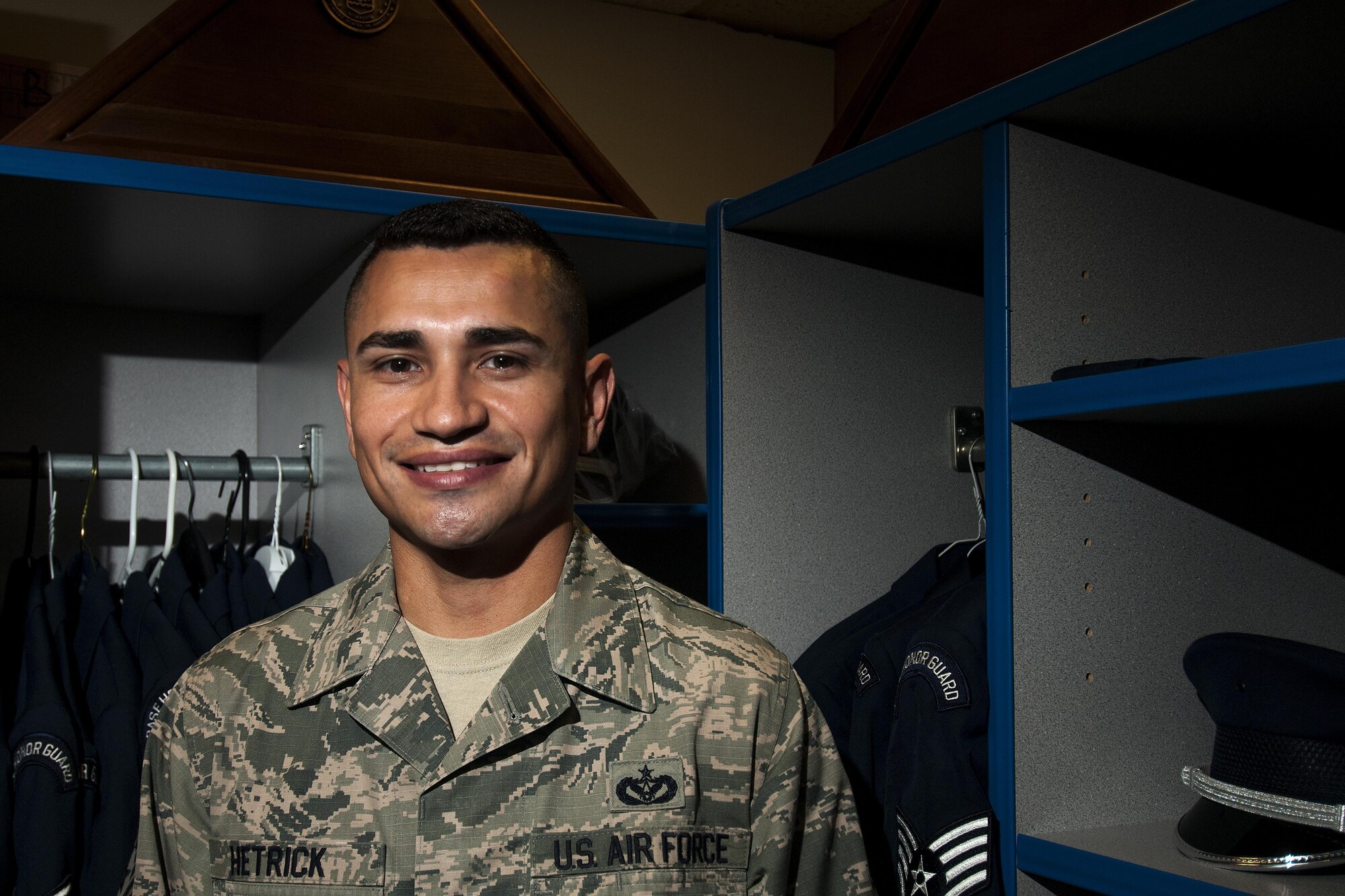 GOODFELLOW AIR FORCE BASE, Texas – Staff Sgt. Albert L. Hetrick, 17th Training Wing Honor Guard NCO in charge, stands in the Honor Guard uniform storage area at Heath Hall April 23. Hetrick is the 2014 Second Air Force Honor Guard Program Manager of the Year awardee and the 2014 Air Education and Training Command Honor Guard Program Manager of the Year. (U.S. Air Force photo/ Senior Airman Scott Jackson)