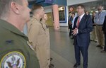 Secretary of Defense Ash Carter meets the flight crew of the MV-22 Osprey that will take him to survey the Straits of Malacca off the coast of Singapore, May 29, 2015.