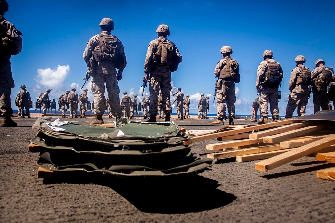 U.S. Marines with Lima Company, Battalion Landing Team 3rd Battalion, 1st Marine Regiment, 15th Marine Expeditionary Unit, fire at targets aboard the USS Essex (LHD 2) at sea in the Pacific Ocean, May 29, 2015. As part of the 15th MEU’s ground combat element, these Marines continue to enhance their combat skills in environments similar to those they may find in future missions. (U.S. Marine Corps photo by Cpl. Elize McKelvey/Released)