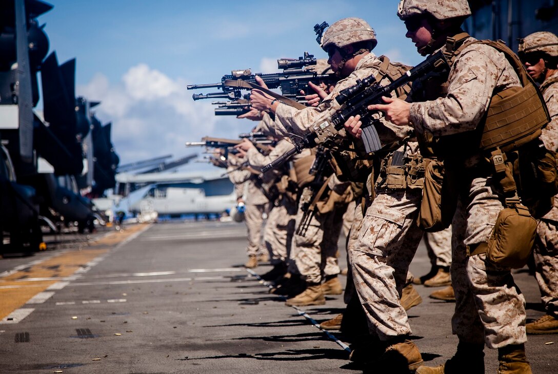 U.S. Marines with Lima Company, Battalion Landing Team 3rd Battalion, 1st Marine Regiment, 15th Marine Expeditionary Unit, fire at targets aboard the USS Essex (LHD 2) at sea in the Pacific Ocean, May 29, 2015. As part of the 15th MEU’s ground combat element, these Marines continue to enhance their combat skills in environments similar to those they may find in future missions. (U.S. Marine Corps photo by Cpl. Elize McKelvey/Released)