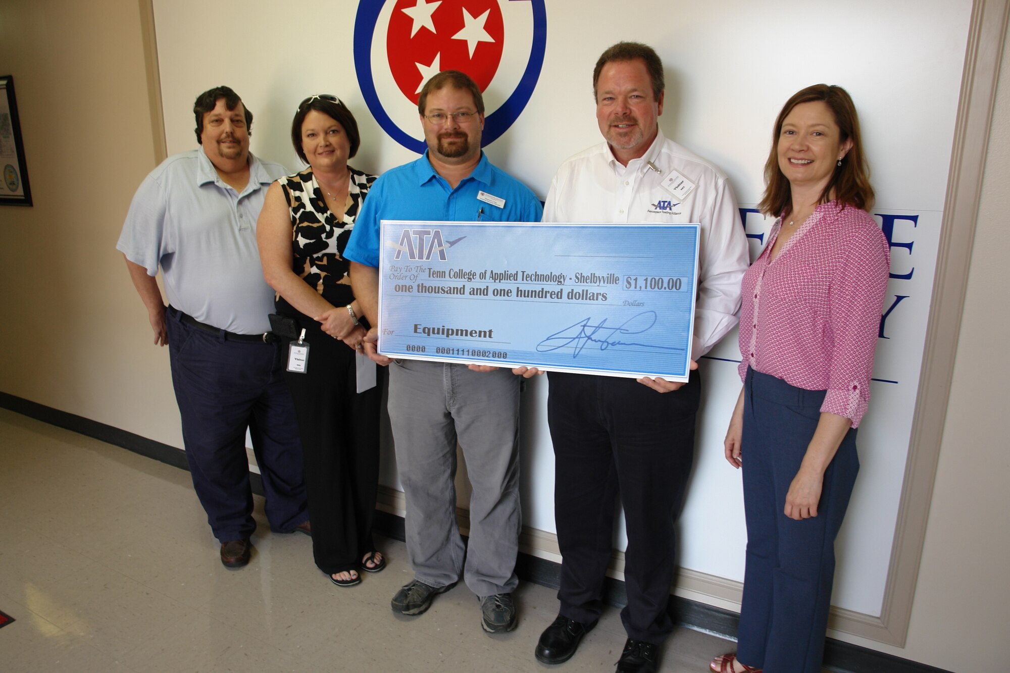 Aerospace Testing Alliance (ATA) donated $1,100 recently to the Tennessee College of Applied Technology-Shelbyville. The money will be used to construct motor process control trainers for the class. According to Industrial Electricity Instructor Shannon Long, the trainers will help in teaching the students motor controls, process controls and troubleshooting skills. “This will also help me bring in more up to date products to give my students an edge,” Long said. “It is our goal to become the leading industry provider for future electricians.”

From left: Industrial Electricity Night Instructor Houston Prater; ATA Employee and Community Activities Committee member Brandi Harmon; Industrial Electricity Instructor Shannon Long; ATA Test Support Branch Manager Walt Bishop and ATA Public Affairs Manager Kathy Gattis.
