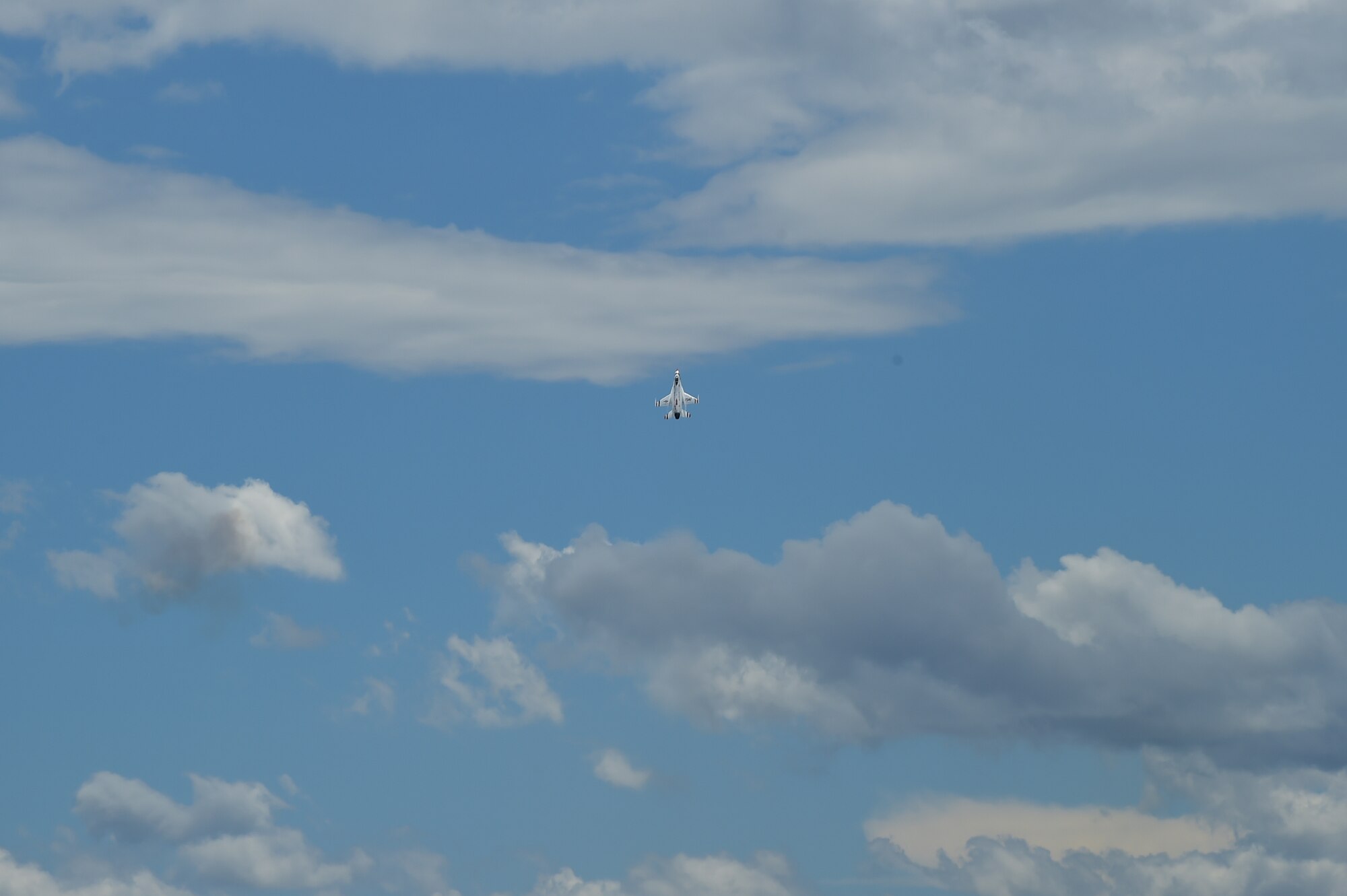 A Thunderbird accelerates upwards May 29, 2015 on Buckley Air Force Base, Colo. The Thunderbirds are staging out of Buckley AFB for the up-coming Rocky Mountain Air Show. (U.S. Air Force photo by Airman 1st Class Luke W. Nowakowski/Released)  