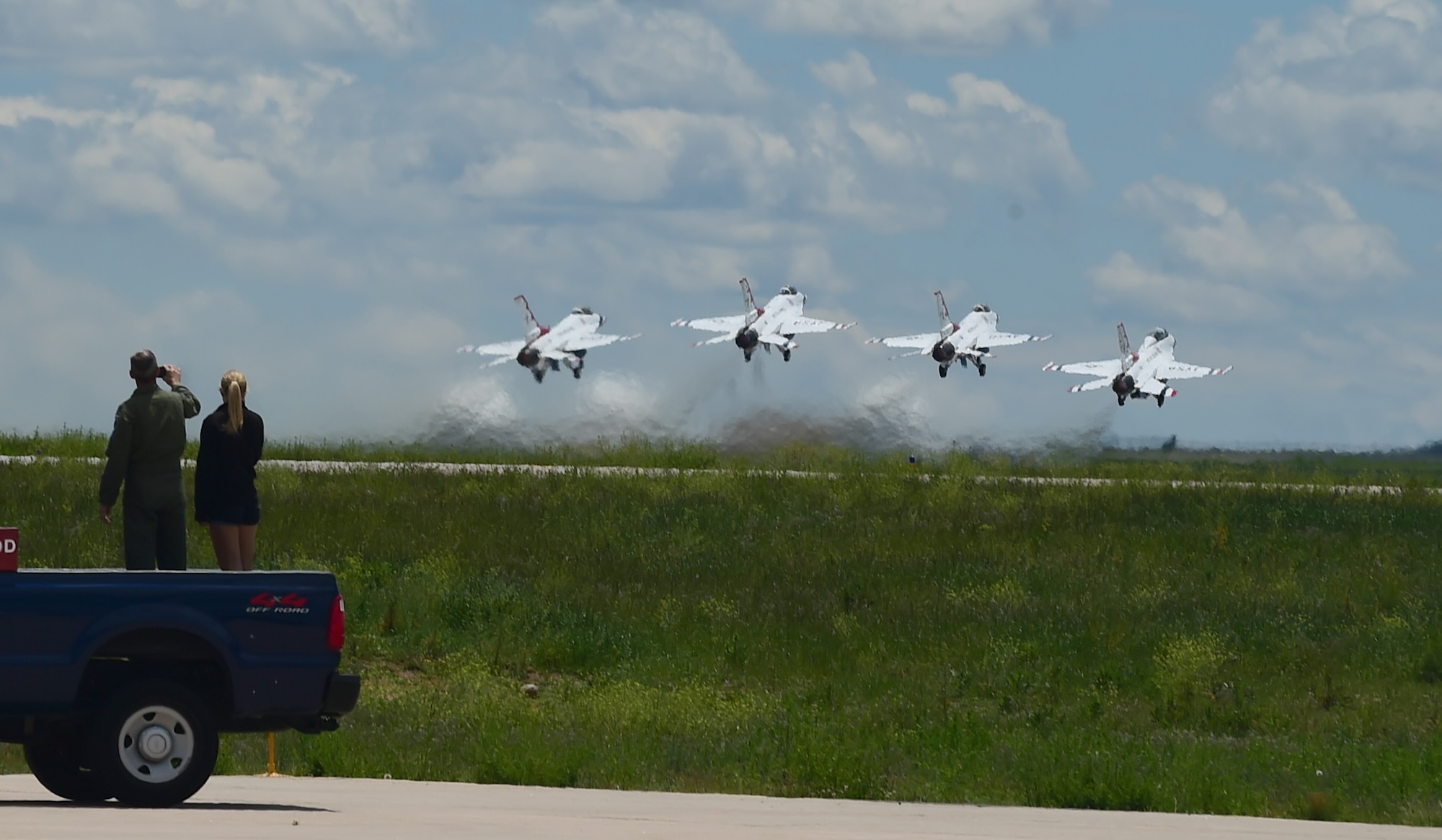 Four Thunderbirds depart for a training mission May 29, 2015 from Buckley Air Force Base, Colo. The Thunderbirds are staging out of Buckley AFB for the up-coming Rocky Mountain Air Show. (U.S. Air Force photo by Airman 1st Class Luke W. Nowakowski/Released)  
