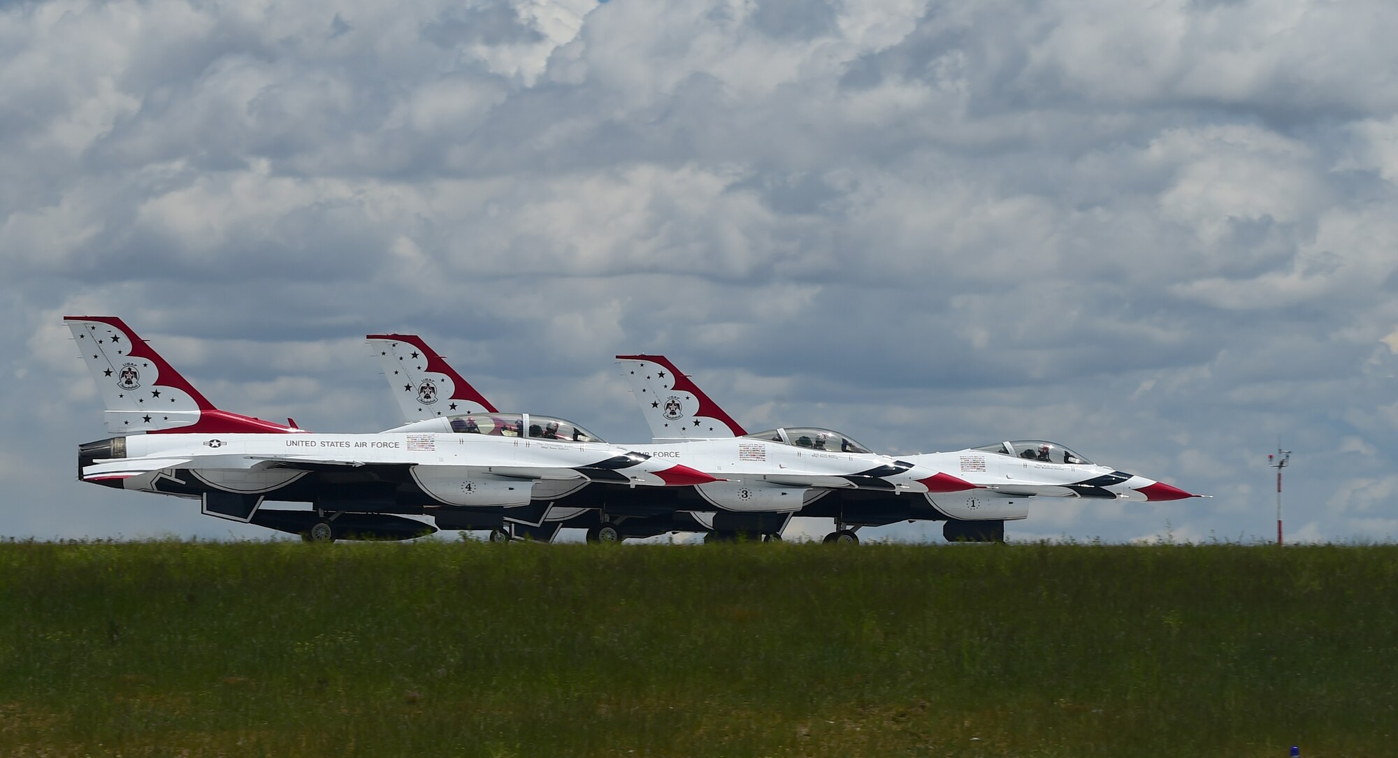 Thunderbirds race down the runway before ascending in the air May 29, 2015 on Buckley Air Force Base, Colo. The Thunderbirds are staging out of Buckley AFB for the up-coming Rocky Mountain Air Show. (U.S. Air Force photo by Airman 1st Class Luke W. Nowakowski/Released)