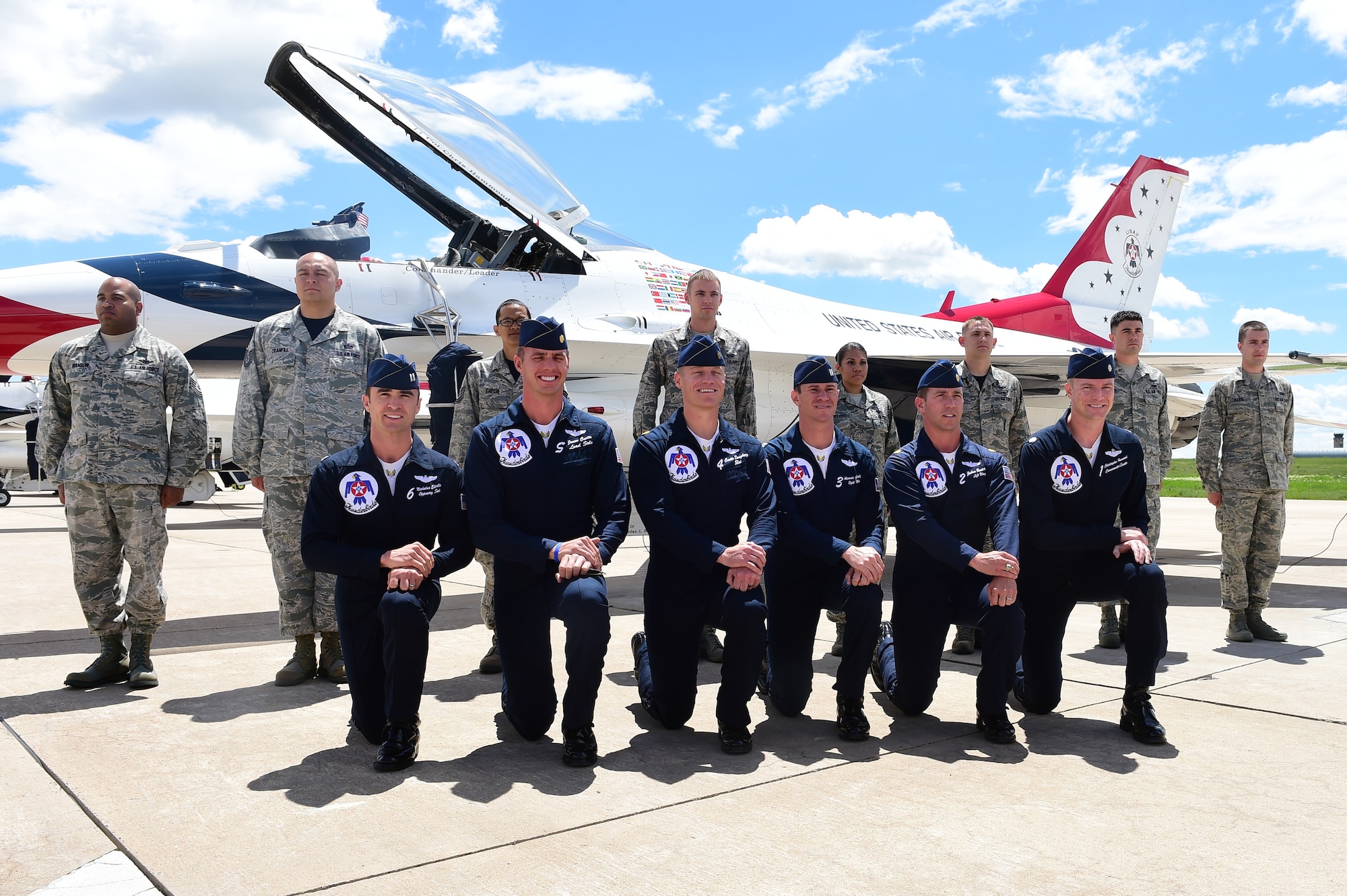 Thunderbird demonstration pilots pose with Team Buckley Airmen May 29, 2015 on Buckley Air Force Base, Colo. The Thunderbirds are staging out of Buckley AFB for the up-coming Rocky Mountain Air Show. (U.S. Air Force photo by Airman 1st Class Luke W. Nowakowski/Released)