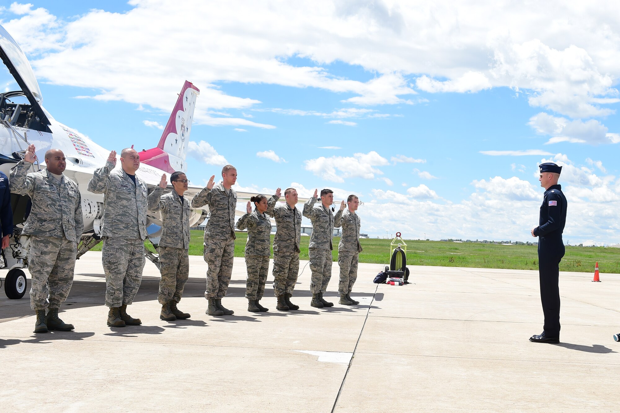 Lt. Col. Christopher Hammond, Thunderbird 1, re-enlists Team Buckley Airmen May 29, 2015 on Buckley Air Force Base, Colo. The Thunderbirds are staging out of Buckley AFB for the up-coming Rocky Mountain Air Show. (U.S. Air Force photo by Airman 1st Class Luke W. Nowakowski/Released)