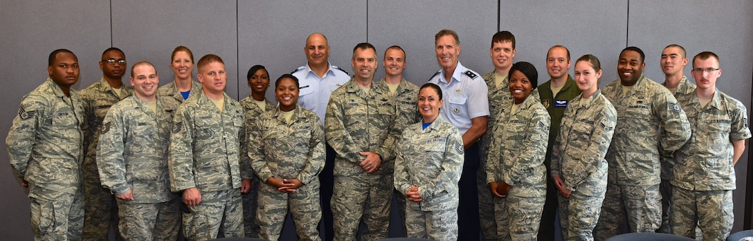 Maj. Gen. Richard S. "Beef" Haddad, Vice Commander, Air Force Reserve Command, Robins Air Force Base (AFB), Georgia, (wearing blues, left) and Maj. Gen. Brian Dominguez, Mobilization Assistant to the Commander, Headquarters Air Mobility Command at Scott AFB, Illinois, (wearing blues, right) along with Col. Karl E. Goerke, Commander, 932nd Airlift Wing, (center) enjoyed  lunch with several 932nd members at a Deserving Airmen luncheon May 29 at Scott AFB. Haddad spoke to the group about new training programs and took time to answer questions. (U.S. Air Force photo/Tech. Sgt. Christopher Parr)