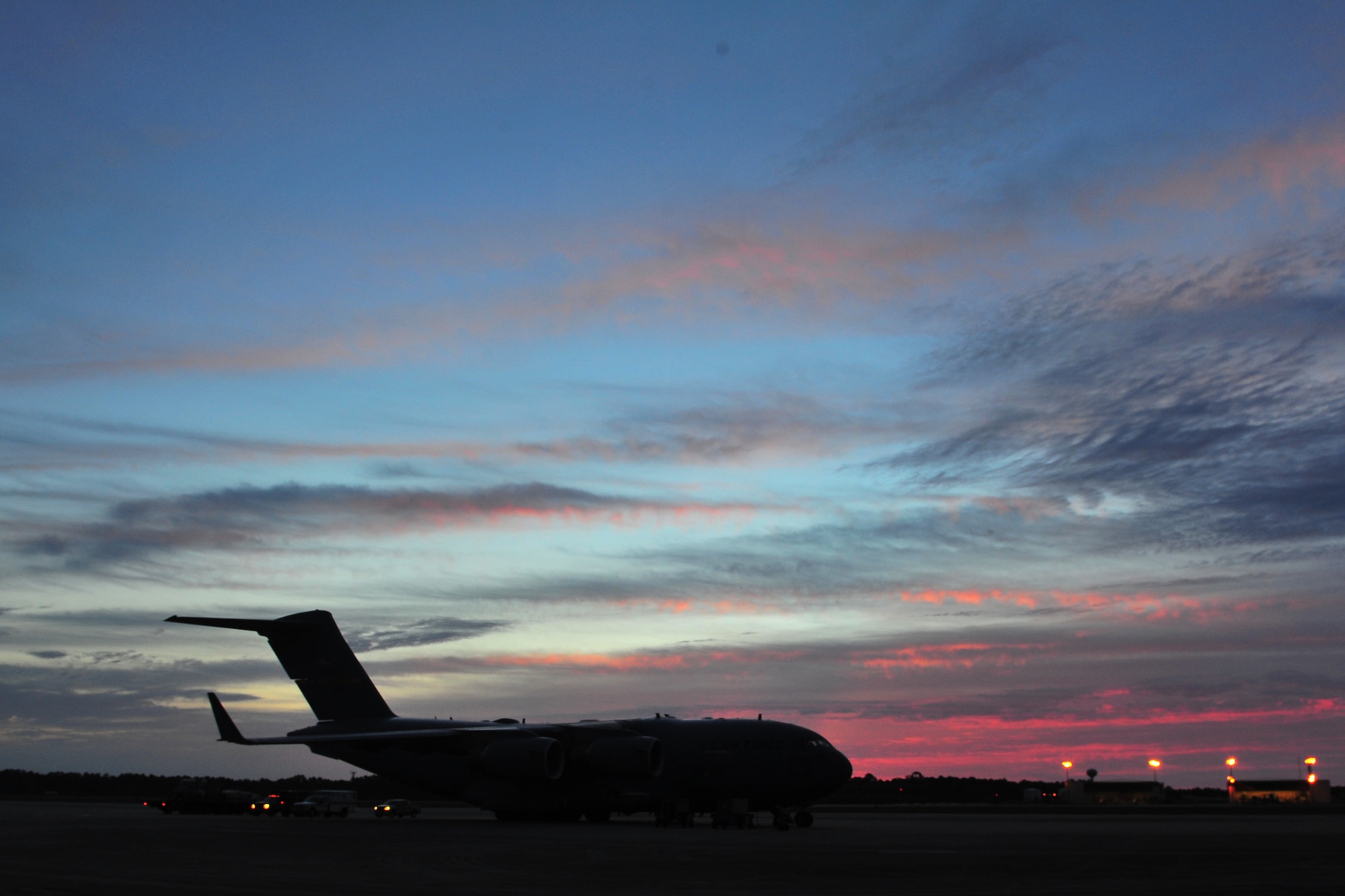 A C-17 Globemaster from Charleston Air Force Base, S.C. sits on the flightline, May 27, 2015, from Hurlburt Field, Fla.  The C-17 was loaded with 823rd RED HORSE members and medical vehicles and took off in support of NEW HORIZONS 2015, an annual event conducted to train military civil engineers and medical professionals to deploy and conduct joint operations. (U.S. Air Force photo by Airman 1st Class Ryan Conroy/Released)  