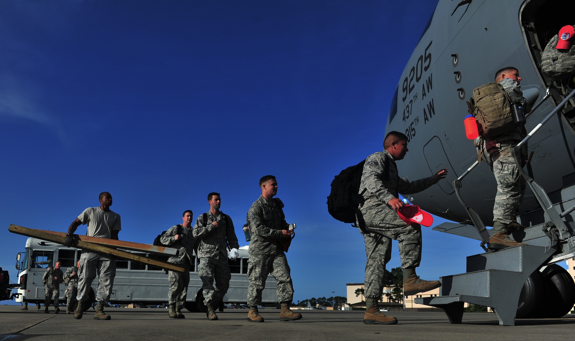 Members of the 823rd RED HORSE board a C-17 Globemaster, May 27, 2015, at Hurlburt Field, Fla. Twelfth Air Force , in conjunction with the U.S. Embassy and government of Honduras, is currently conducting NEW HORIZONS 2015, an annual event conducted to train military civil engineers and medical professionals to deploy and conduct joint operations.  (U.S. Air Force photo by Airman 1st Class Ryan Conroy/Released)  