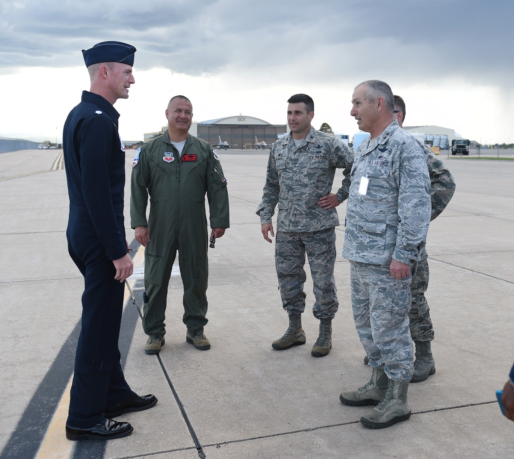 A Thunderbirds demonstration pilot speaks with Team Buckley leadership May 28, 2015, on the flight line on Buckley Air Force Base, Colo. The Thunderbirds team is staging out of Buckley AFB and will be performing in the 2015 Rocky Mountain Air Show May 30-31. (U.S. Air Force photo by Airman 1st Class Samantha Meadors/Released)