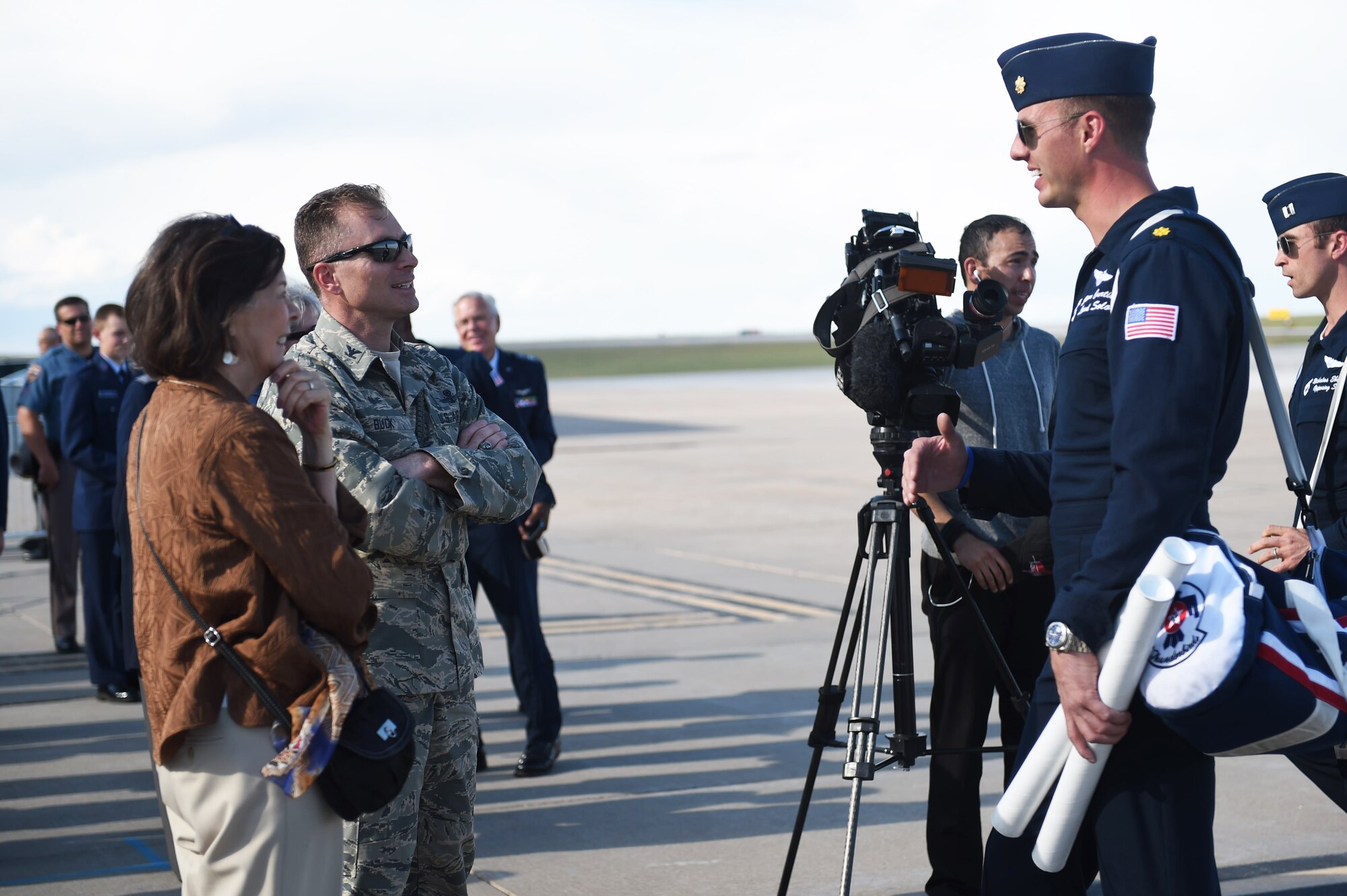 Maj. Jason Curtis, Thunderbird 5, speaks with Col. Darren Buck, 460th Vice Wing commander, May 28, 2015, on the flight line on Buckley Air Force Base, Colo. The Thunderbirds team is staging out of Buckley AFB and will be performing in the 2015 Rocky Mountain Air Show May 30-31. (U.S. Air Force photo by Airman 1st Class Samantha Meadors/Released)