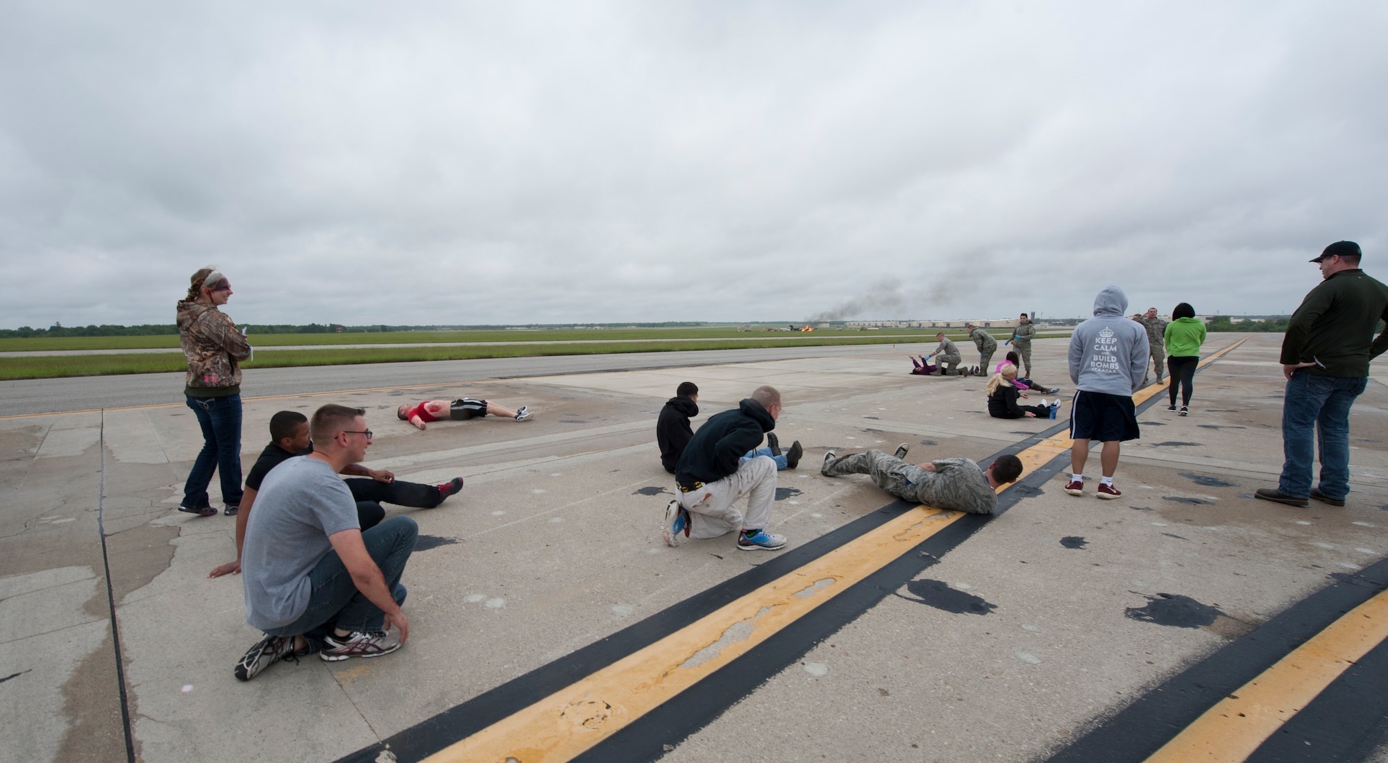 Patients from a simulated aircraft accident look for help from 509th Medical Group first responders during a major accident response exercise May 20, 2015, at Whiteman Air Force Base, Mo. In the event an incident occurs, the medics are split up into immediate, delayed and minimal response treatment teams. (U.S. Air Force photo by Staff Sgt. Brigitte N. Brantley/Released)