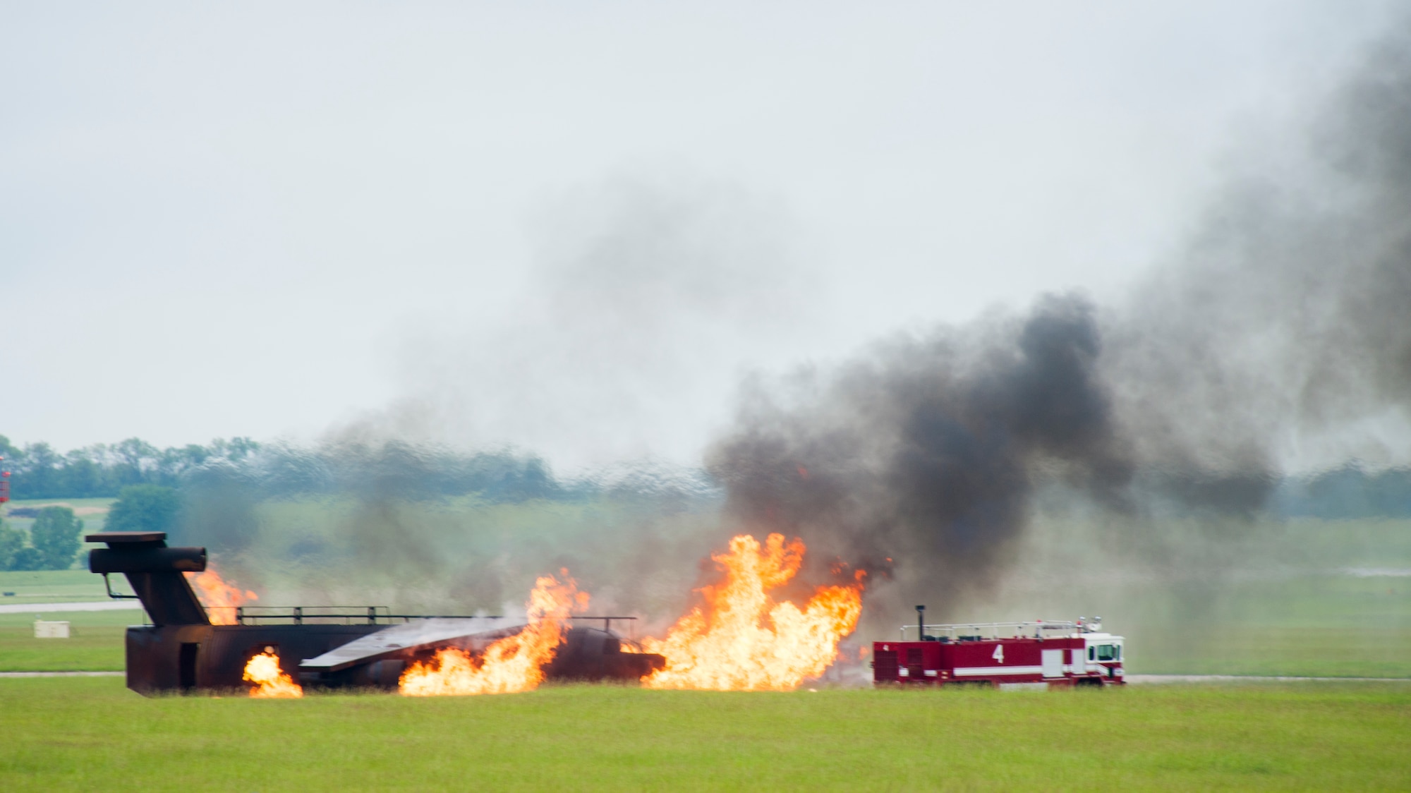 Firefighters from the 509th Civil Engineer Squadron respond to a simulated aircraft crash during a major accident response exercise May 20, 2015, at Whiteman Air Force Base, Mo. Constant training ensures that all first responders are ready to react to incidents at a moment’s notice. (U.S. Air Force photo by Staff Sgt. Brigitte N. Brantley/Released)