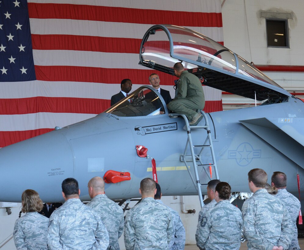 Major Mansour Elhihi gives a tour of an F-15 Eagle to NATO Secretary General Jens Stoltenberg and Mayor Alvin Brown at the 125th Fighter Wing, Jacksonville Florida on May 28, 2015. 