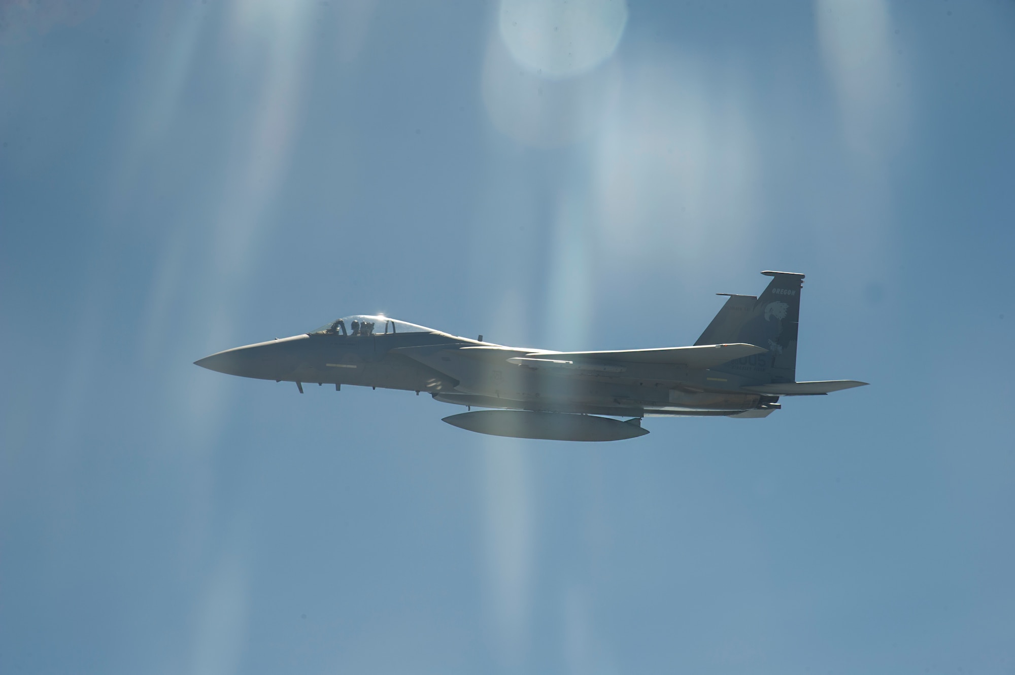 An F-15C, flying out of the 173rd Fighter Wing, Kingsley Field Air National Guard Base, Klamath Falls Oregon, begins a wingtip formation while his comrades get refueled by a KC-135 Stratotanker May 27, 2015, over Oregon.  The incentive flight enables Airmen to see the air refueling mission that Fairchild provides to the Department of Defense. (U.S. Air Force photo/Airman 1st Class Nicolo J. Daniello)