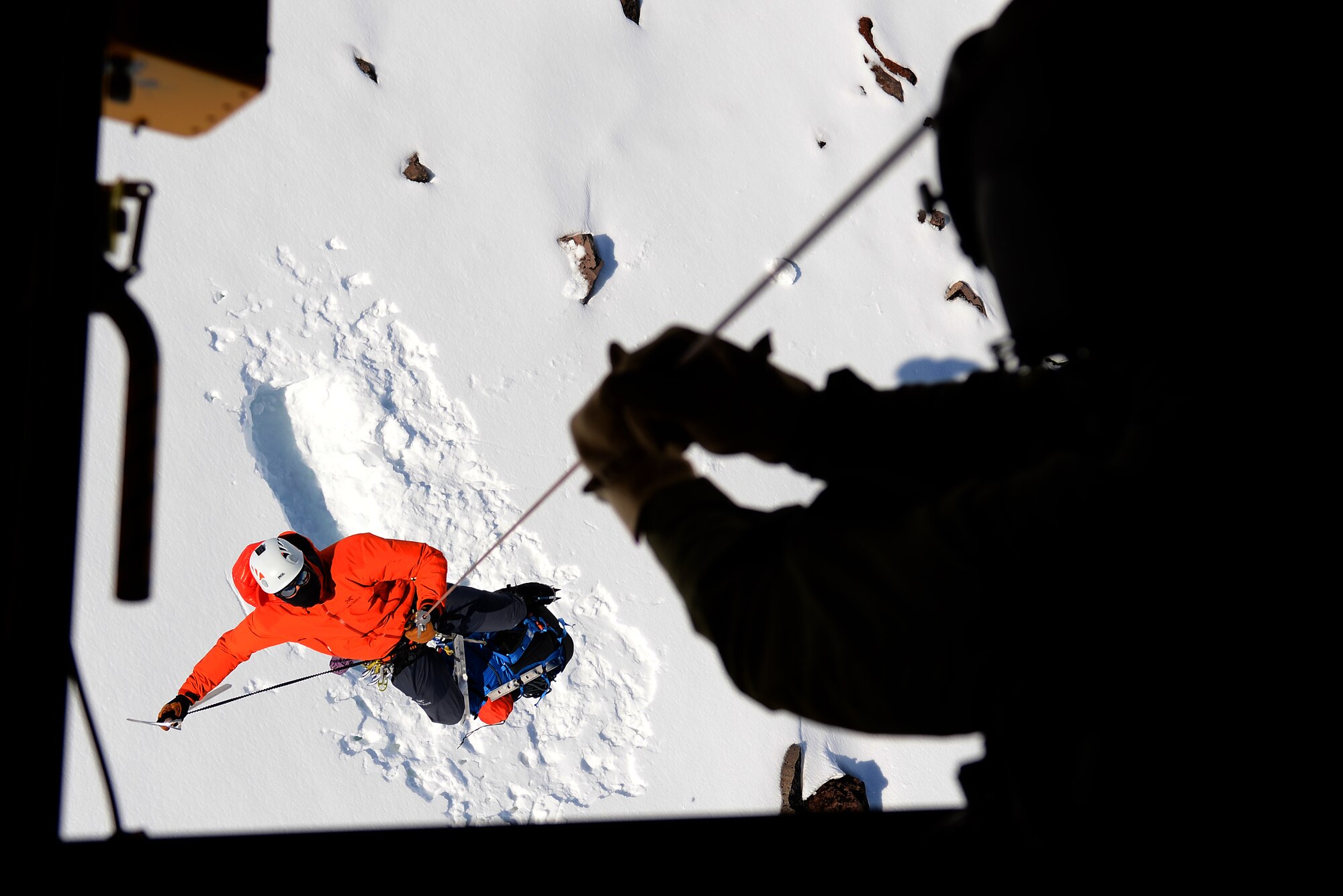 Tech. Sgt. Dean Criswell, 22nd Special Tactics Squadron NCOIC of rescue operations, is hoisted into a CH-47 Chinook from the 1-214th Aviation Regiment, May 15, 2015 on Mount Rainer, Wash. Criswell is part of a mountain rescue team made up of the National Parks Service, Army Reserve and the 22 STS. (U.S. Air Force photo by Staff Sgt. Tim Chacon) 