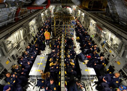 Sixty-nine members of the Fairfax County Urban Search and Rescue Team await takeoff on a U.S. Air Force C-17 Globemaster III at Dover Air Force Base, Del., April 26, 2015. The specially trained team and approximately 70,000 pounds of their supplies were deployed to Nepal to assist with rescue operations after the country was struck by a 7.8-magnitude earthquake. (U.S. Air Force photo by Airman 1st Class William Johnson)