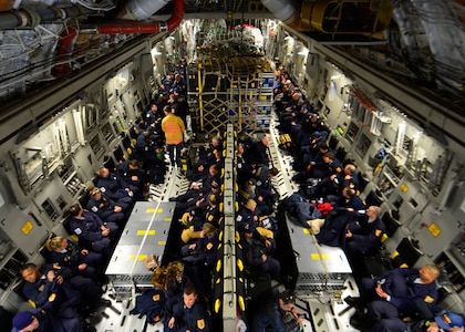 Sixty-nine members of the Fairfax County Urban Search and Rescue Team await takeoff on a U.S. Air Force C-17 Globemaster III at Dover Air Force Base, Del., April 26, 2015. The specially trained team and approximately 70,000 pounds of their supplies were deployed to Nepal to assist with rescue operations after the country was struck by a 7.8-magnitude earthquake. (U.S. Air Force photo by Airman 1st Class William Johnson)