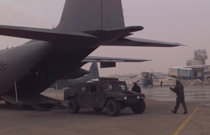 A U.S. Army Humvee is unloaded from a U.S. Air Force C-130 Hercules at the airport in Sarajevo, Bosnia and Herzegovina, Dec. 18, 1995. The Humvee was used to support the NATO Enabling Force during Operation JOINT ENDEAVOR. The strategic airflow for Operation JOINT ENDEAVOR began as the international effort to implement the Dayton Peace Accords in Bosnia and other states of the former Yugoslavia. Enabling forces moved into the Croatia, Bosnia and Herzegovina, and Slovenia theaters of operation to prepare entry points for the main Implementation Force. The Humvee belonged to the 3rd Battalion, 10th Special Forces, Fort Carson, Colo.  (U.S. Air Force photo by Senior Airman Jeffrey Allen). 