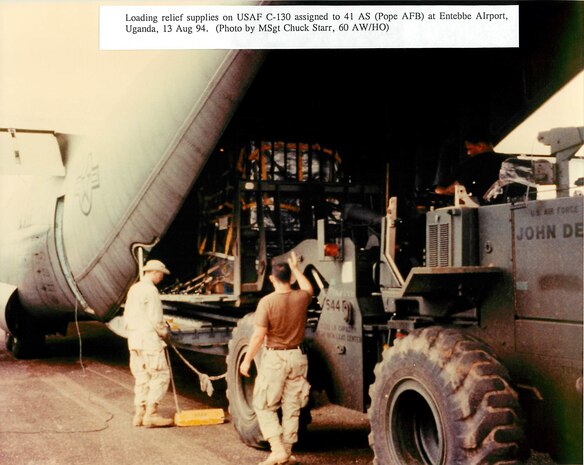 Mobility Airmen load relief supplies onto a 41st Airlift Squadron C-130 Hercules from Pope Air Force Base, N.C., Aug. 13, 1994. Following massacres in Rwanda, Air Mobility Command mounted Operation SUPPORT HOPE, flying 1,200 airlift sorties and delivering 15 tons of humanitarian aid to Rwanda. (U.S. Air Force photo by Master Sgt. Chuck Starr).