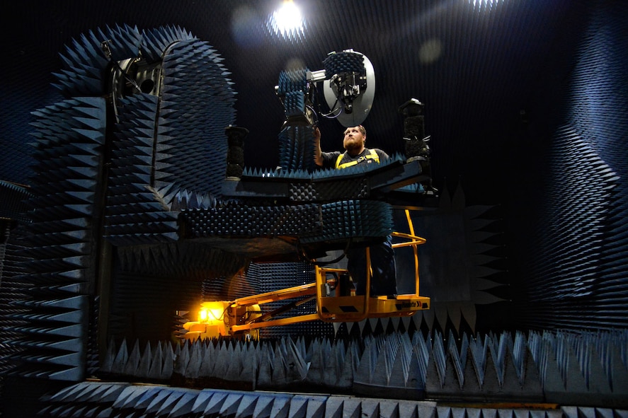Electronics mechanic J.D. Drake, with the 550th Commodities Maintenance Squadron, checks the equipment in Building 3707’s compact range. Commodities has four compact ranges on base. This one performs electrical tests on KC-135 variant nose radomes. (Air Force photo by Kelly White/Released)