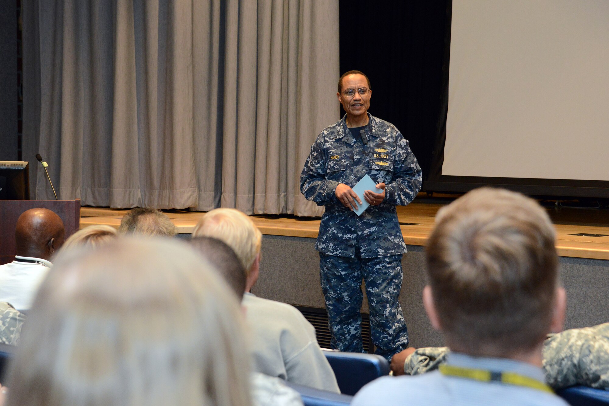 U.S. Navy Adm. Cecil D. Haney, U.S. Strategic Command commander, introduces former U.S. Army Air Corps Cpl. Robert D. Holts (not pictured), an original Tuskegee Airman, and representatives from the Alfonza W. Davis Chapter of Tuskegee Airmen Inc. during their visit to USSTRATCOM headquarters, Offutt Air Force Base, Neb., May 26, 2015. The delegation shared information about their organization, told stories about Holts' experience in the Army Air Corps and answered questions from the audience. Holts, the last known surviving Tuskegee Airman from Nebraska, was sworn into service at Fort Crook, now Offutt AFB, in 1942 and served as a drafting engineer and logistics specialist until 1946. The term "Tuskegee Airmen" refers to everyone - to include men and women, African Americans and Caucasians - involved in the "Tuskegee Experience," the Army Air Corps program to train African Americans to fly and maintain combat aircraft. Contrary to popular belief, this includes not just pilots, but navigators, bombardiers, maintenance support staff, instructors and all personnel who kept the planes in the air. USSTRATCOM is one of nine DOD unified combatant commands and is charged with strategic deterrence; space operations; cyberspace operations; joint electronic warfare; global strike; missile defense; intelligence, surveillance and reconnaissance; combating weapons of mass destruction; and analysis and targeting. (USSTRATCOM photo by U.S. Air Force Staff Sgt. Jonathan Lovelady/Released)
