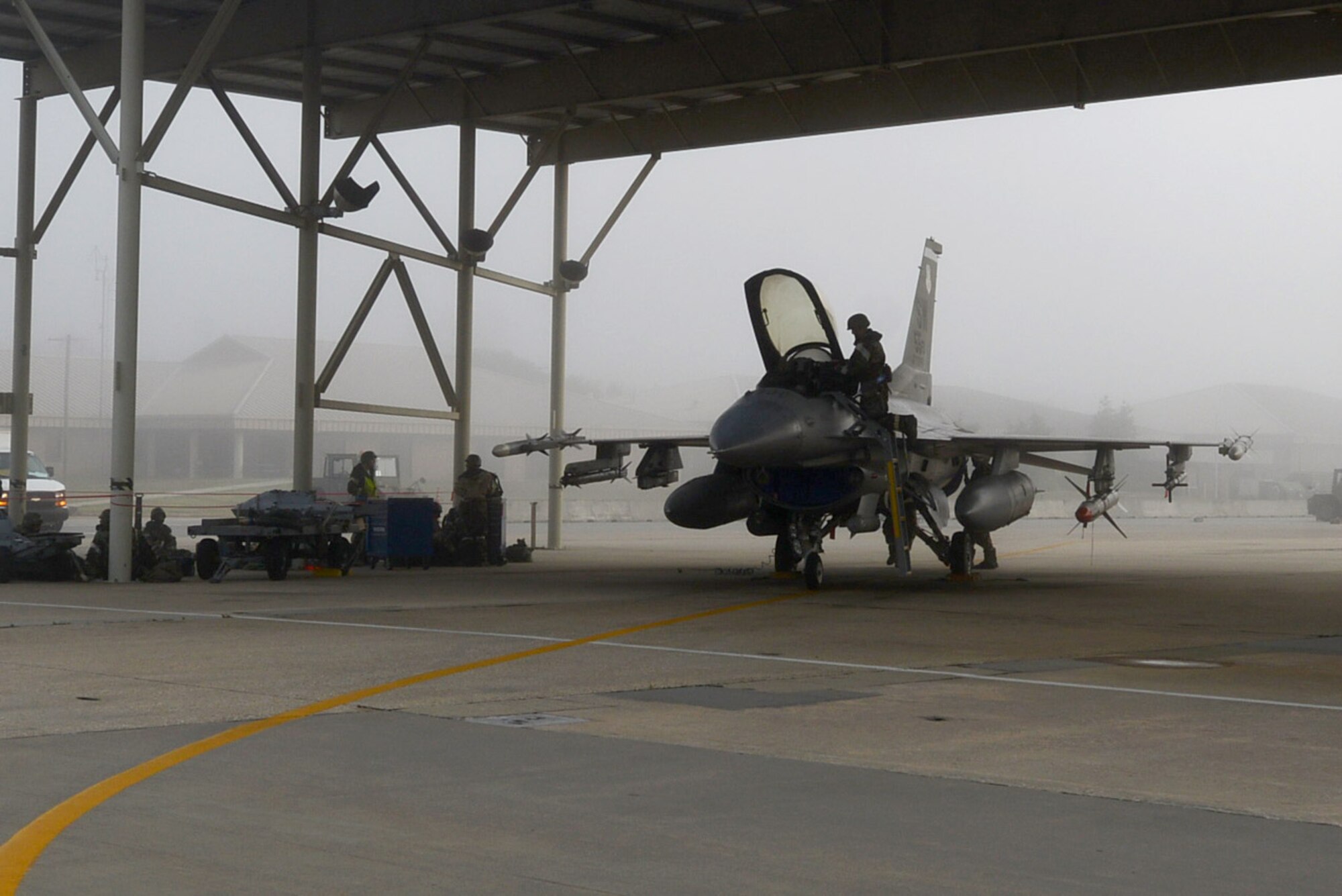 U.S. Air Force Airmen prepare an F-16CM Fighting Falcon during operational readiness exercise Weasel Victory 15-06 at Shaw Air Force Base, S.C., May 28, 2015. During an ORE, Airmen perform their duties under simulated deployed conditions. (U.S. Air Force photo by Senior Airman Diana M. Cossaboom/Released)