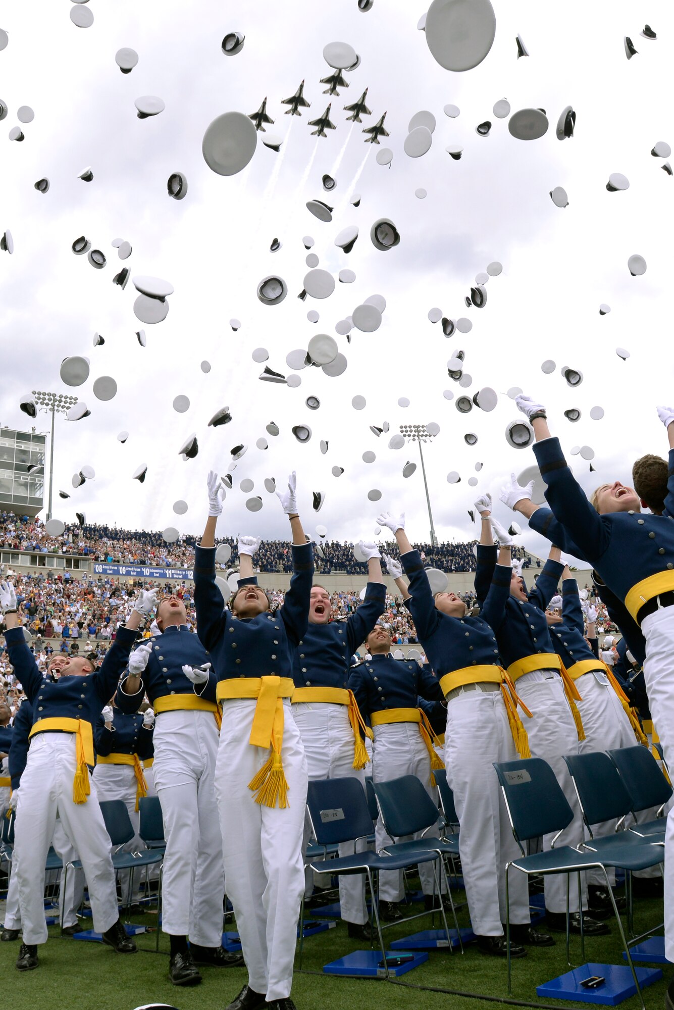 Newly-minted second lieutenants toss their hats in the air at the culmination of the U.S. Air Force Academy's Class of 2015 graduation ceremony here, May 28, 2015.(U.S. Air Force photo/Mike Kaplan)