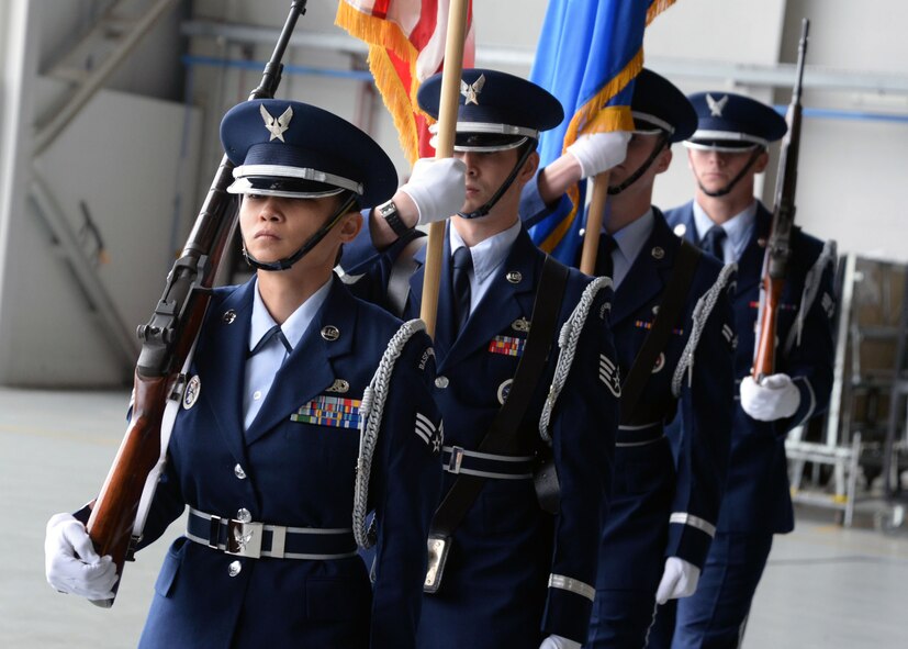 RAF Mildenhall Honor Guard Airmen post the colors during the 100th Air Refueling Wing change of command ceremony May 29, 2015, on RAF Mildenhall, England. During the ceremony, Col. Kenneth T. Bibb Jr., outgoing 100th ARW commander, relinquished command and Col. Thomas D. Torkelson, 100th ARW commander, assumed authority. (U.S. Air Force photo by Senior Airman Christine Halan/Released)