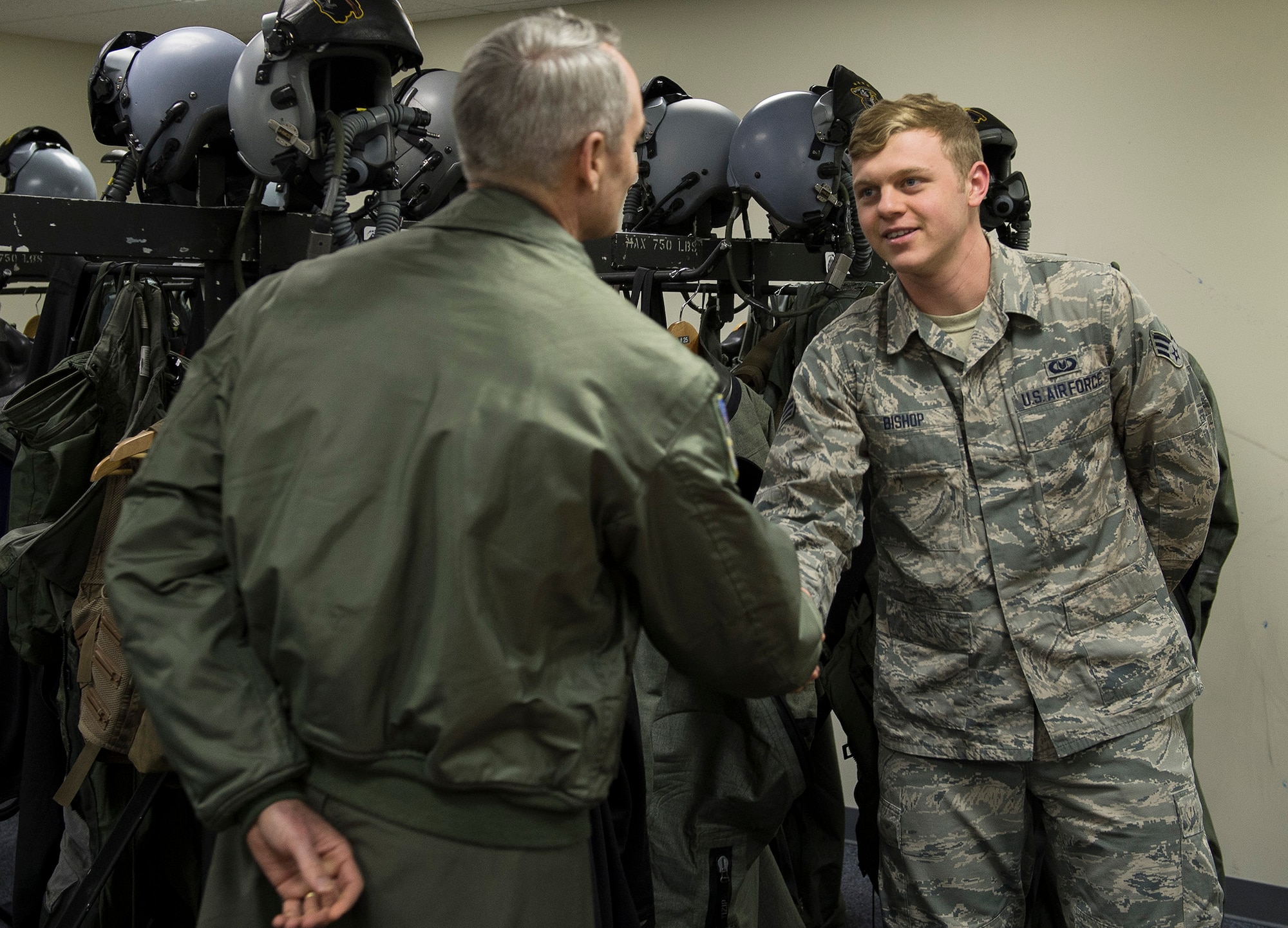 U.S. Air Force Lt. Gen. Darryl Roberson, 3rd Air Force commander, congratulates U.S. Air Force Senior Airman Justin Bishop, 871st Air Expeditionary Squadron aircrew flight equipment journeyman, on his recent selection to the Air Force Academy Preparatory School at the Icelandic Air Surveillance and Policing operations center in Keflavik, Iceland, April 23, 2015. Roberson toured the facilities and spoke with Airmen regarding the IAS mission, an ongoing NATO commitment to maintain the security of Iceland’s airspace. (U.S. Air Force photo by Staff Sgt. Chad Warren/Released)