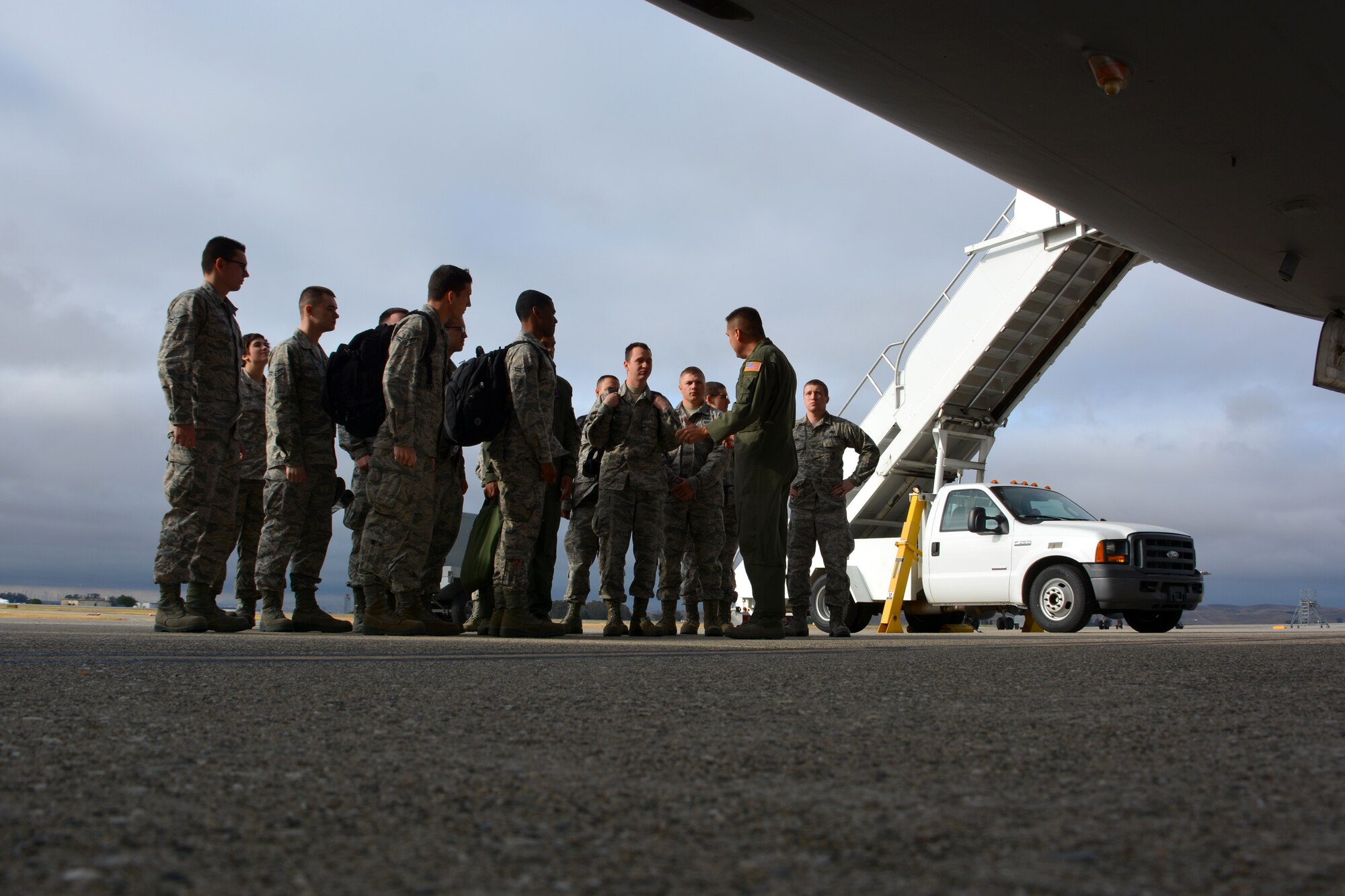 Senior Master Sgt. Shane Hickman, 9th Air Refueling Squadron superintendent, speaks to more than a dozen first-term Airmen May 21, 2015, prior to an incentive flight onboard the KC-10 Extender at Travis Air Force Base, California. The flight is part of an initiative to expose junior Airmen to the operational mission at Travis. (U.S. Air Force photo by Senior Airman Charles Rivezzo)