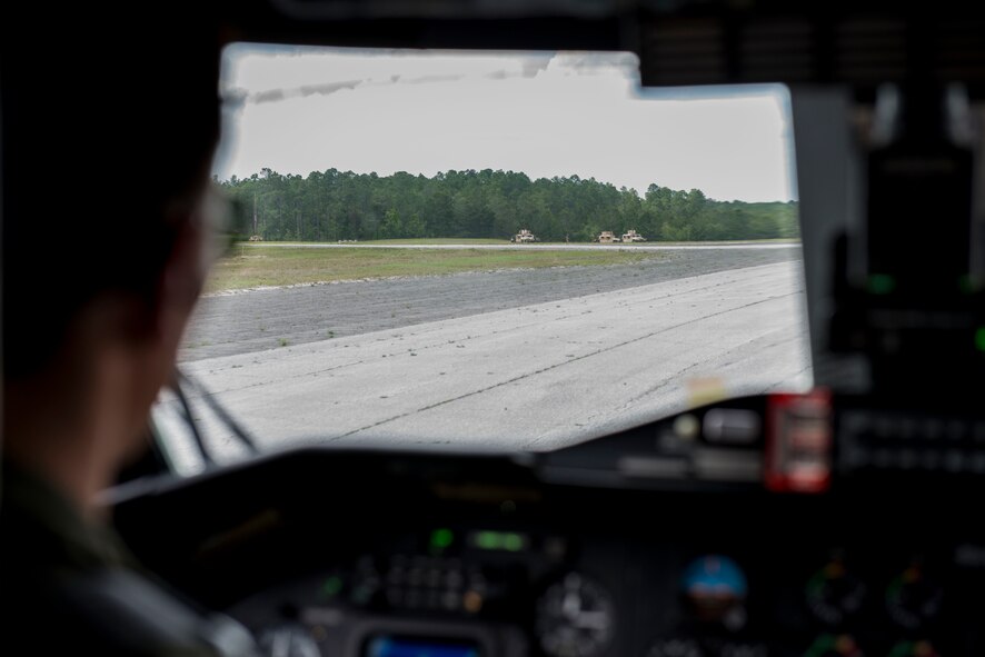 A pilot from the 6th Special Operations Squadron has a view of the members from the Special Tactics Training Squadron, 24th Special Operations Wing, Hurlburt Field, Fla., when he lands the C-145 during a runway security training exercise at Eglin Range, Fla., April 23, 2015. The STTS delivers advanced and special tactics skills to a wide variety of joint special operations career fields, including combat.  (U.S. Air Force photo/ Tech. Sgt. Jasmin Taylor)