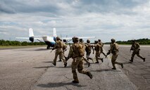 Special Tactics Airmen from the Special Tactics Training Squadron, 24th Special Operations Wing, Hurlburt Field, Fla., secure the runway to load a passenger in the back of a Duke Field C-145 at Eglin Range, Fla., April 23, 2015. The STTS delivers advanced and special tactics skills to a wide variety of joint special operations career fields, including combat controllers and special tactics pararescuemen. (U.S. Air Force photo/ Tech. Sgt. Jasmin Taylor)
