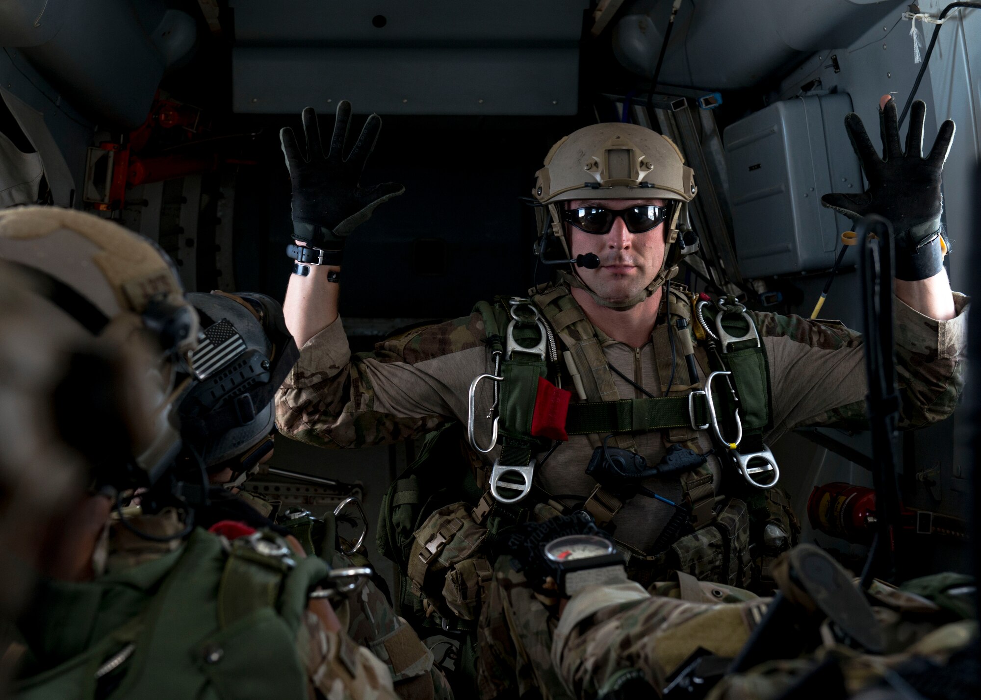 The jumpmaster from the Special Tactics Training Squadron, 24th Special Operations Wing, Hurlburt Field, Fla., gives the ten minute warning in the back of a Duke Field C-145 before the team’s free-fall at Eglin Range, Fla., April 23, 2015. The STTS delivers advanced and special tactics skills to a wide variety of joint special operations career fields, including combat controllers and special tactics pararescuemen. (U.S. Air Force photo/ Tech. Sgt. Jasmin Taylor)