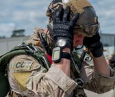 A Special Tactics combat controller from the Special Tactics Training Squadron, 24th Special Operations Wing, Hurlburt Field, Fla., checks his helmet before the team’s free-fall at Eglin Range, Fla., April 23, 2015. The STTS delivers advanced and special tactics skills to a wide variety of joint special operations career fields, including combat controllers and special tactics pararescuemen. (U.S. Air Force photo/ Tech. Sgt. Jasmin Taylor)