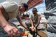 U.S. Air Force Master Sgt. Kirk Sherry, left, assists Staff Sgt. Ilya Barankevich as he drills in a screw on a new foundation that will be used for a gazebo at Coast Guard Sector St. Petersburg, Fla., on May 26, 2015. Airmen from the New Jersey Air National Guard’s 177th Civil Engineering Squadron were on a deployment for training in Florida, partnering with Coast Guard Sector St. Petersburg and Air Station Clearwater. (U.S. Air National Guard photo by Airman 1st Class Amber Powell/Released)