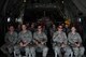 A group of Airmen from the New Jersey Air National Guard's 177th Civil Engineering Squadron, look out from a Coast Guard C-130 Hercules on May 22, 2015. Before the Memorial Day weekend the Airmen, working with Air Station Clearwater on a deployment for training, were able to tour Coast Guard Air Station Clearwater, Fla., and take a flight with the crew on a C-130. (U.S. Air National Guard photo by Airman 1st Class Amber Powell/Released)