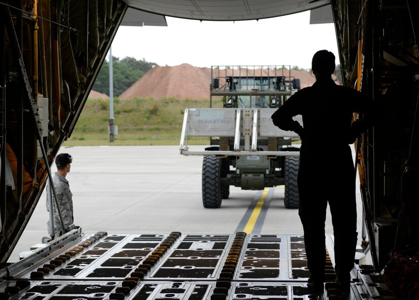 Airman 1st Class Sarah Meadows, 37th Airlift Squadron loadmaster, waits for cargo to be loaded onto a C-130J Super Hercules May 27, 2015, at Ramstein Air Base, Germany. The cargo was flown to Kosovo for an airdrop training exercise. (U.S. Air Force photo/Airman 1st Class Tryphena Mayhugh)