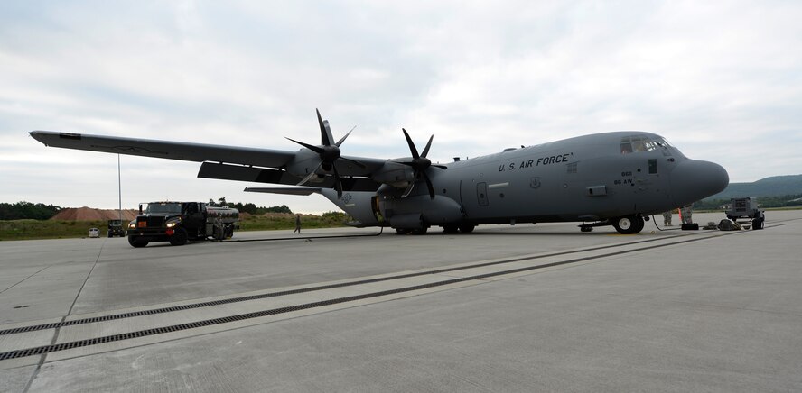 A C-130J Super Hercules is prepped for an airdrop training exercise over Kosovo May 27, 2015, at Ramstein Air Base, Germany. The airdrop was a joint-exercise between the 37th Airlift Squadron and the 5th Quartermaster Company, Theatre Aerial Delivery Company, to enhance interoperability.  (U.S. Air Force photo/Airman 1st Class Tryphena Mayhugh)