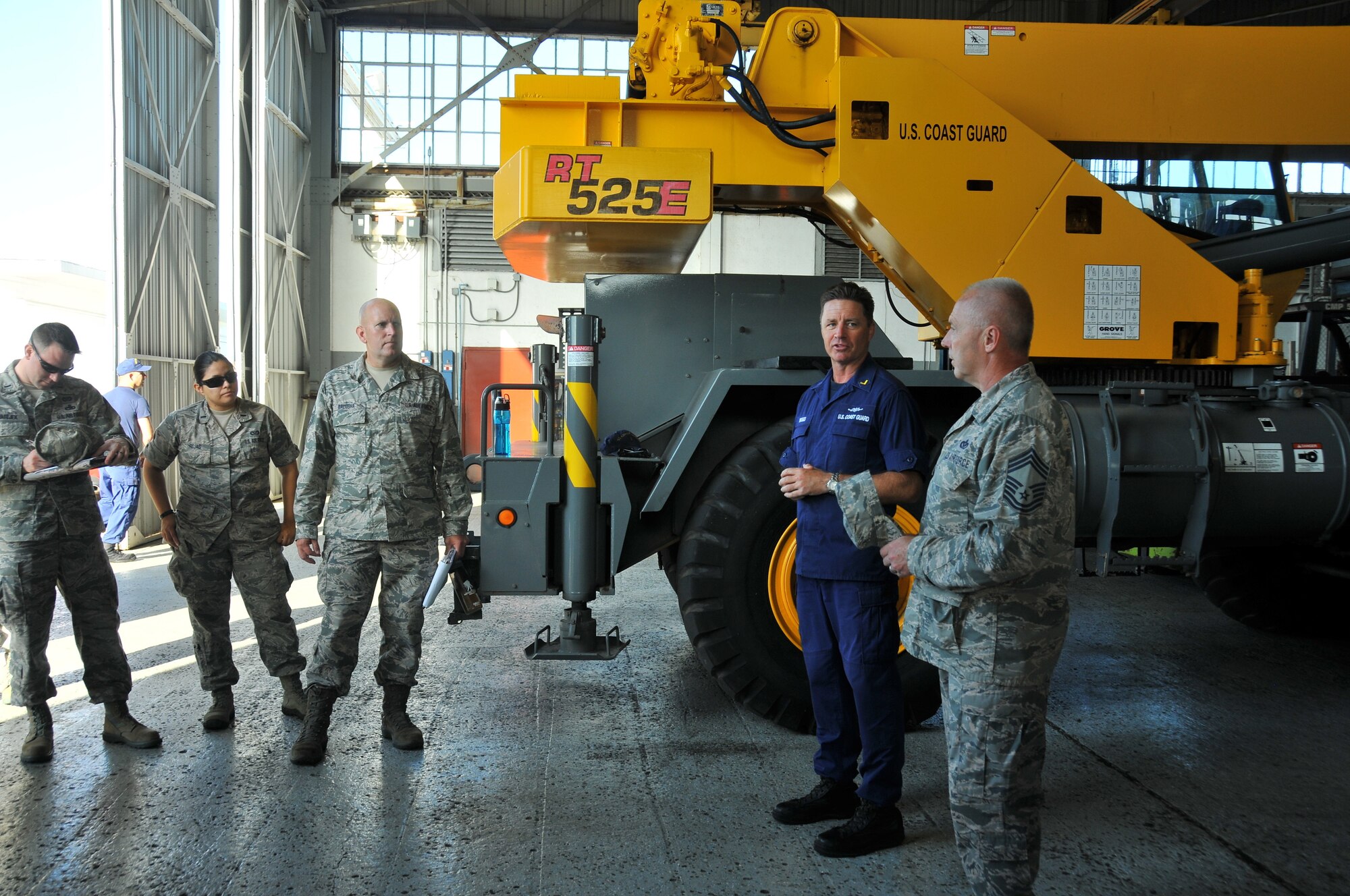 A picture of U.S. Air Force Airmen from the 177th Civil Engineering Squadron meeting with Chief Warrant Officer Jason Briggs, Facility Engineer.