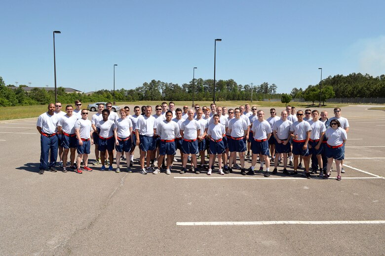 Pope Field Airmen including members from the 3rd Aerial Port Squadron pose for a group photo prior to participating in a memorial ‘Port Dawg’ 5K run around the Pope Field flightline May 13 honoring seven fallen air transportation Airmen who lost their lives in 2014. (U.S. Air Force photo/Marvin Krause)