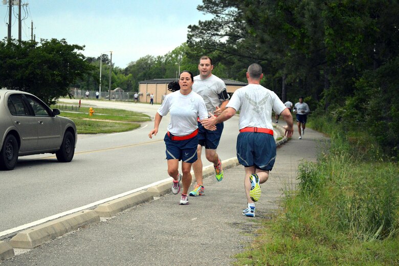 Pope Field Airmen including members from the 3rd Aerial Port Squadron participate in a memorial ‘Port Dawg’ 5K run around the Pope Field flightline May 13 honoring seven fallen air transportation Airmen who lost their lives in 2014. (U.S. Air Force photo/Marvin Krause)